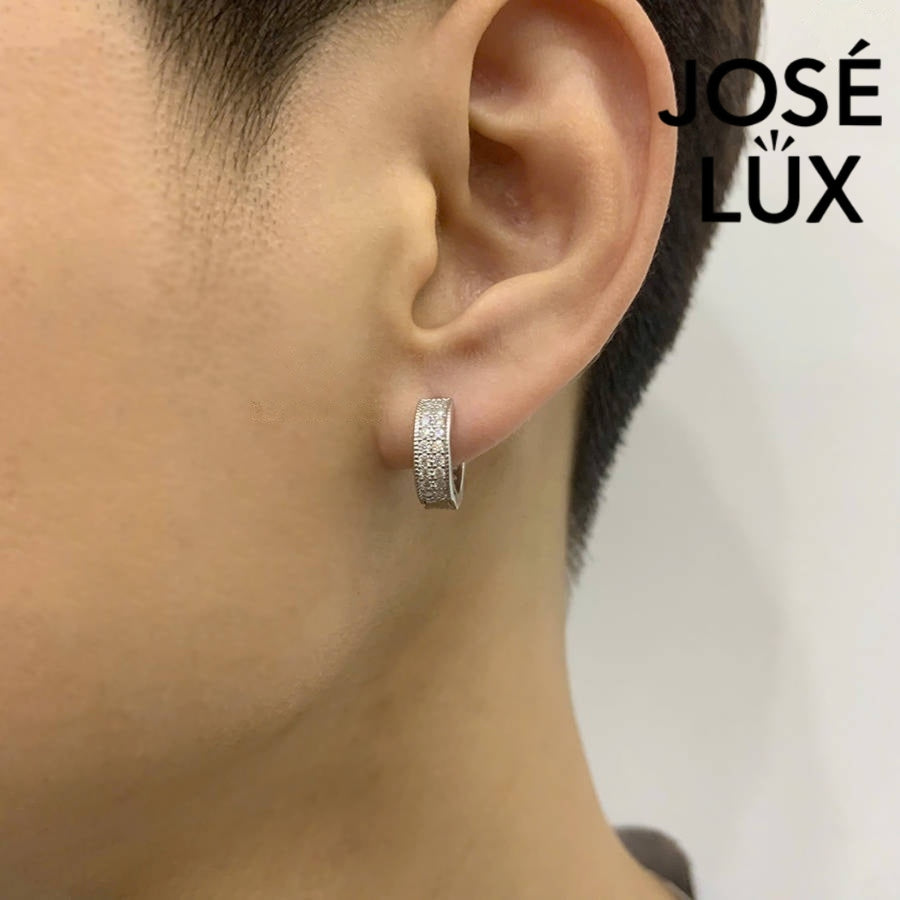 Model wearing Iced Moissanite Hoop Earrings for Men by José Lux, highlighting the sterling silver huggie hoop fit and sparkling moissanite accents.