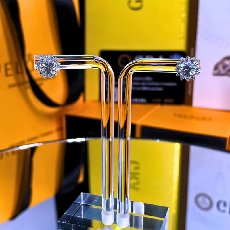 Brilliant sunburst-inspired moissanite with sparkling halo setting in sterling silver. Radiant design captures exceptional fire and scintillation for luminous everyday elegance.