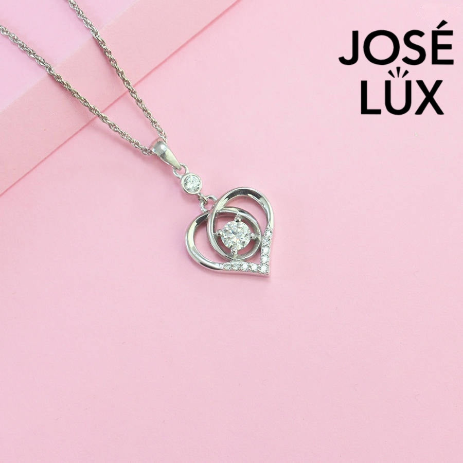 Heartfelt 0.5ct round moissanite dancing heart pendant features floating center stone within layered heart design, tenderly crafted in polished sterling silver