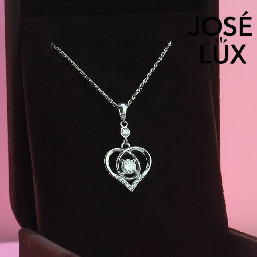 Heartfelt 0.5ct round moissanite dancing heart pendant features floating center stone within layered heart design, tenderly crafted in polished sterling silver