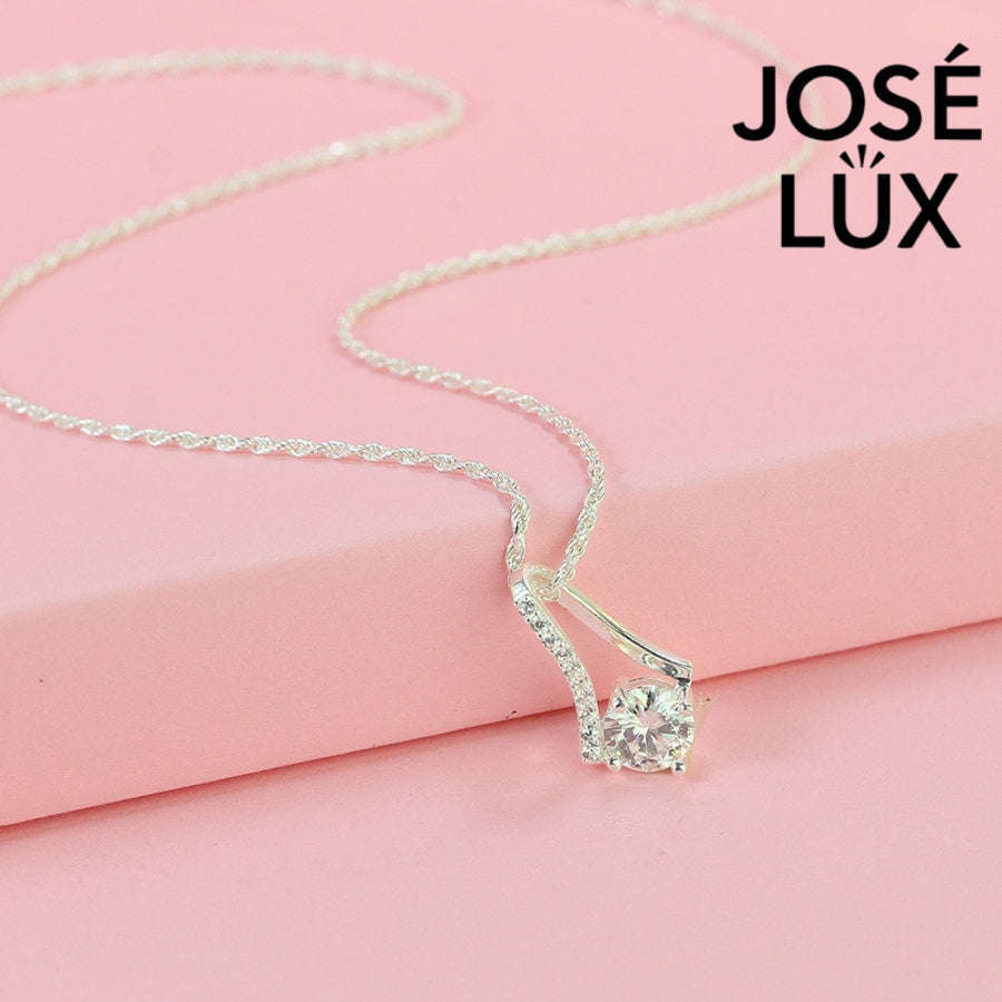 Sleek 0.8ct round moissanite angular frame pendant showcases modern geometric design with pavé-accented linear elements, expertly constructed in premium sterling silver.