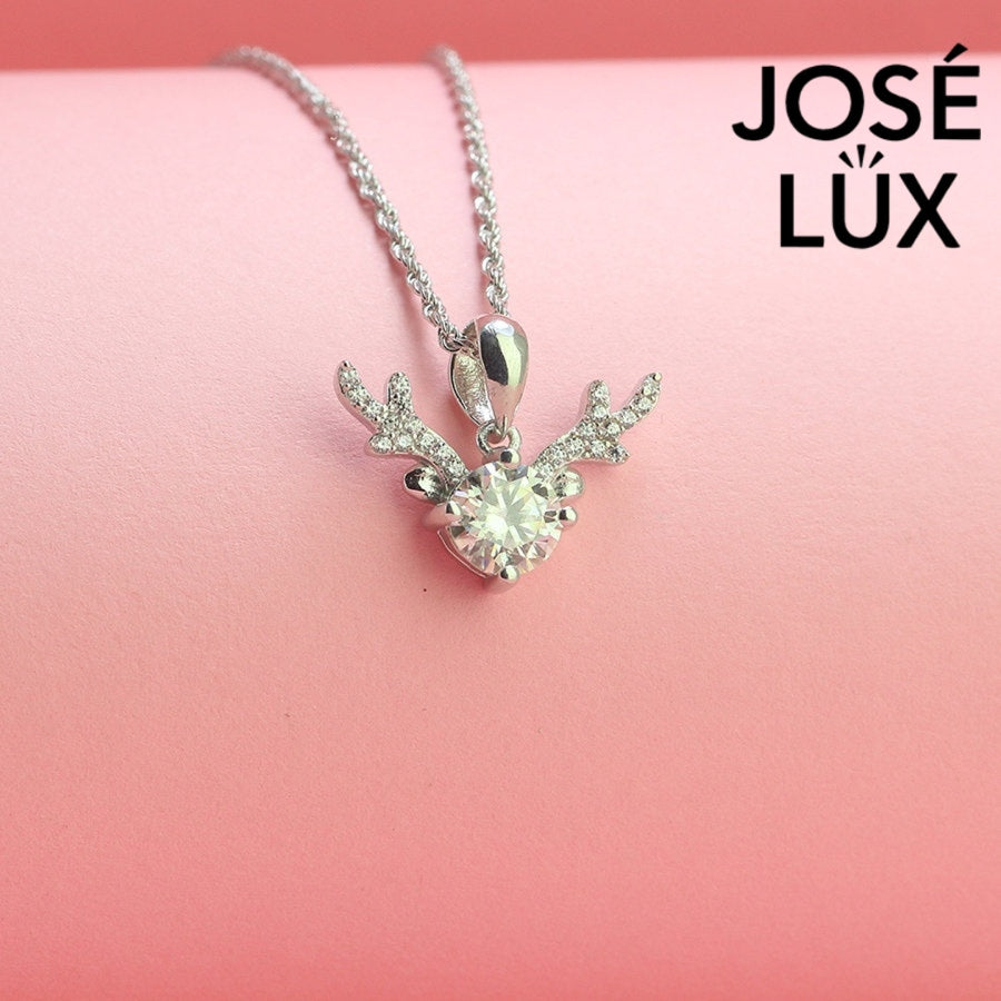 Enchanting 0.8ct round moissanite reindeer antler pendant features brilliant center stone with pavé-set antler details, capturing woodland magic in sterling silver.