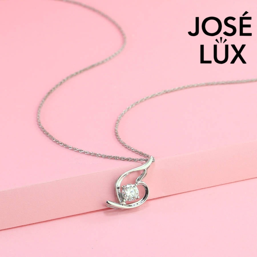 Modern 0.8ct round moissanite swirl solitaire pendant displays graceful flowing curves that beautifully cradle the brilliant stone in sleek sterling silver craftsmanship.