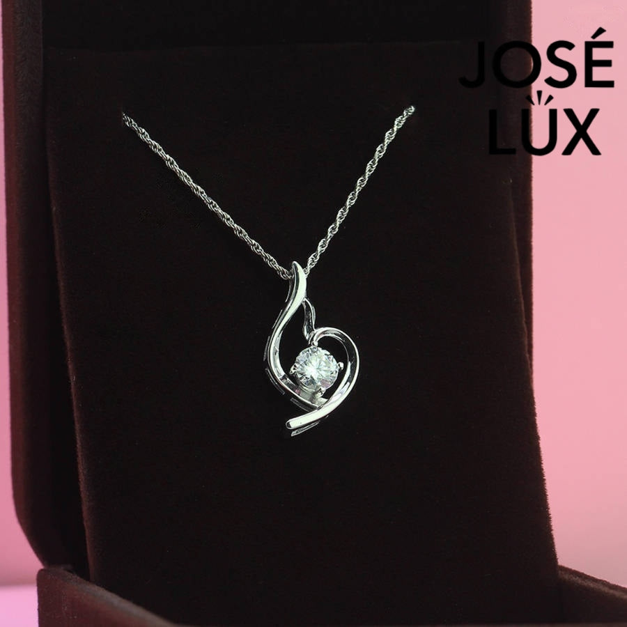 Modern 0.8ct round moissanite swirl solitaire pendant displays graceful flowing curves that beautifully cradle the brilliant stone in sleek sterling silver craftsmanship.