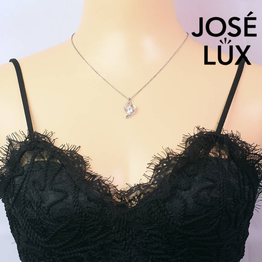 Modern 0.8ct round moissanite swirl solitaire pendant displays graceful flowing curves that beautifully cradle the brilliant stone in sleek sterling silver craftsmanship.