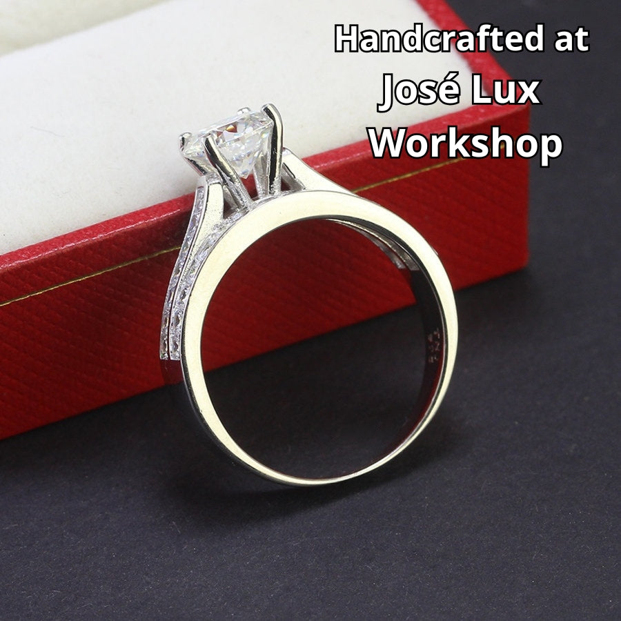 Stunning harmony set includes 1.25ct moissanite engagement ring with matching channel-set wedding band, beautifully crafted in sterling silver.