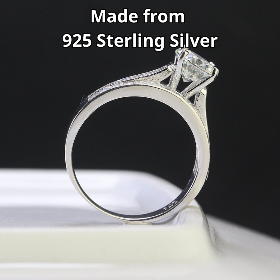 Stunning harmony set includes 1.25ct moissanite engagement ring with matching channel-set wedding band, beautifully crafted in sterling silver.