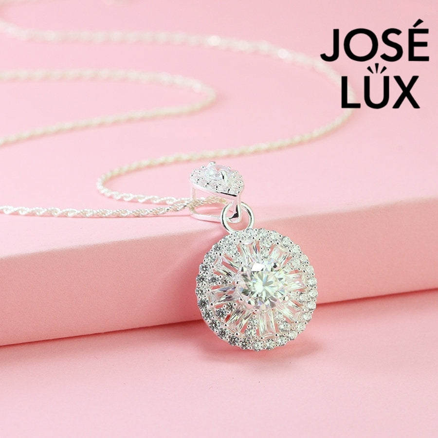 Sophisticated 1.2ct moissanite pendant features elegant teardrop and round halo design, creating stunning layered brilliance in beautifully crafted sterling silver jewelry