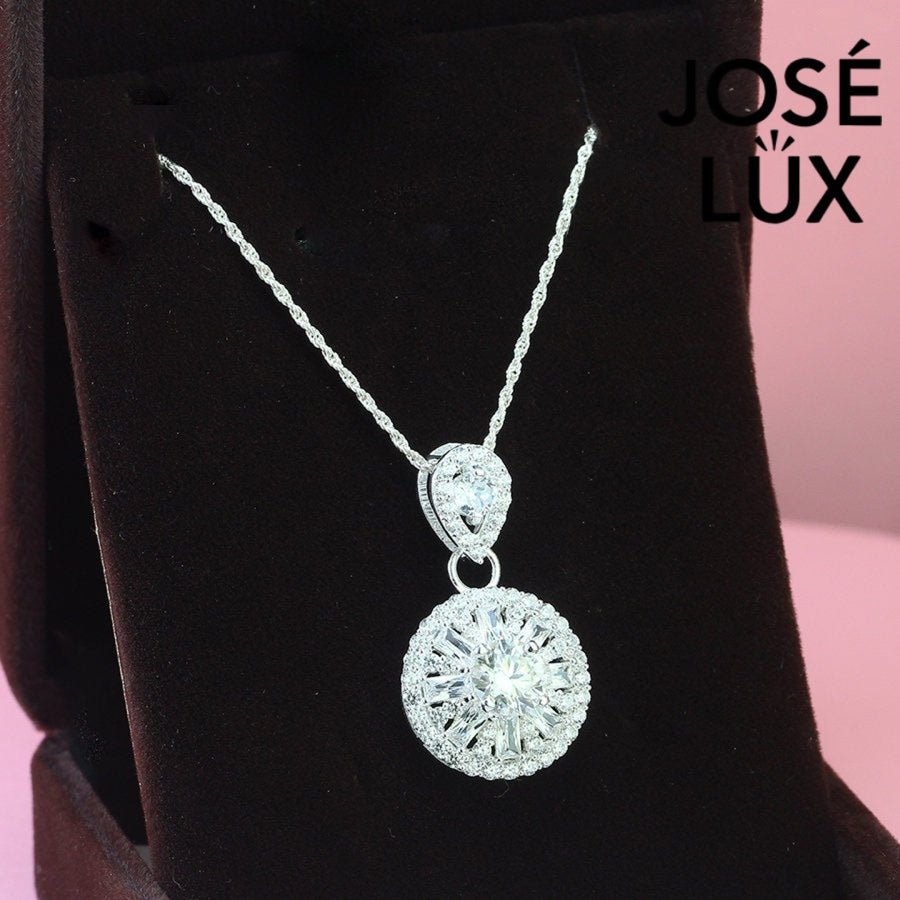 Sophisticated 1.2ct moissanite pendant features elegant teardrop and round halo design, creating stunning layered brilliance in beautifully crafted sterling silver jewelry
