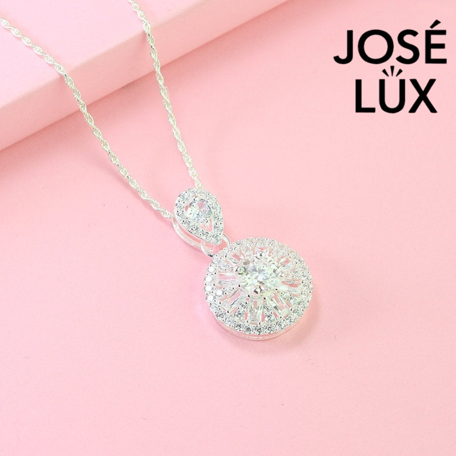 Sophisticated 1.2ct moissanite pendant features elegant teardrop and round halo design, creating stunning layered brilliance in beautifully crafted sterling silver jewelry