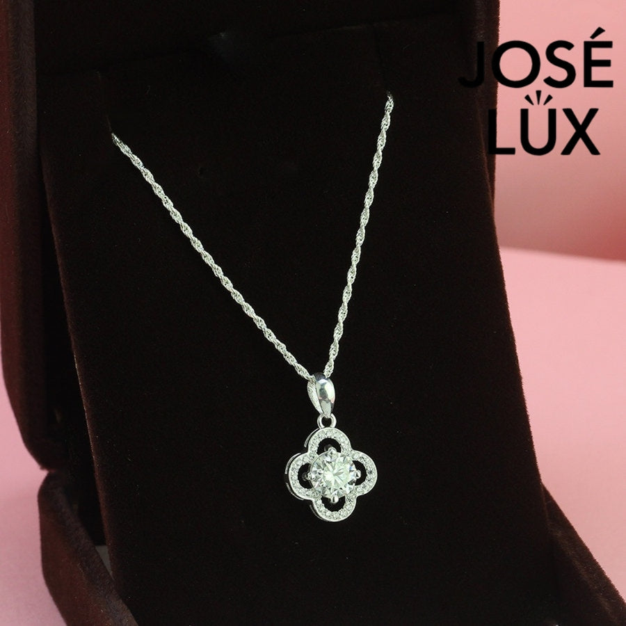 Lucky 1ct round moissanite clover halo pendant symbolizes good fortune with pavé-accented quatrefoil design, gracefully handcrafted in polished sterling silver.