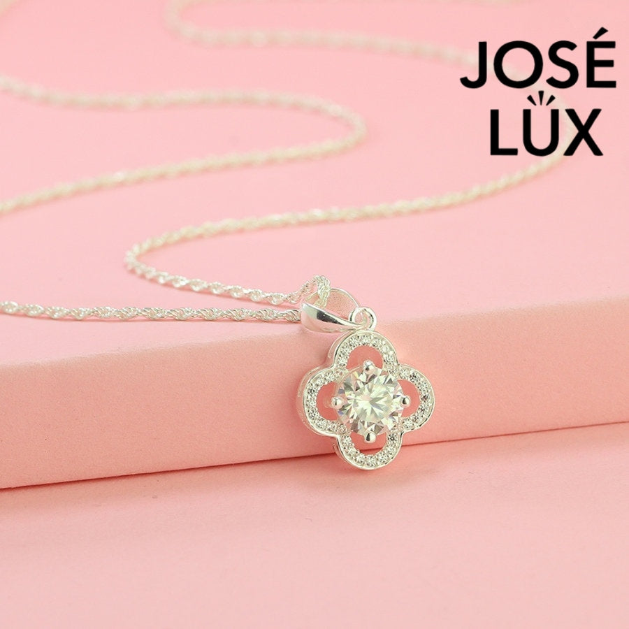 Lucky 1ct round moissanite clover halo pendant symbolizes good fortune with pavé-accented quatrefoil design, gracefully handcrafted in polished sterling silver.