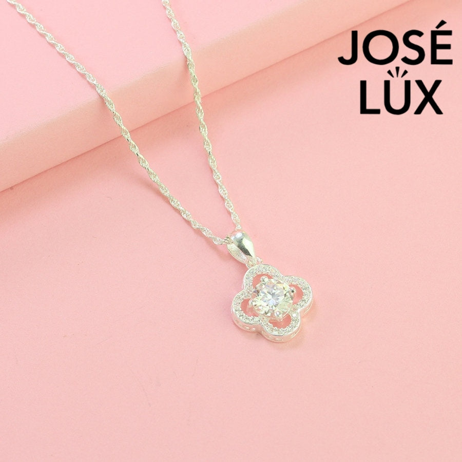 Lucky 1ct round moissanite clover halo pendant symbolizes good fortune with pavé-accented quatrefoil design, gracefully handcrafted in polished sterling silver.