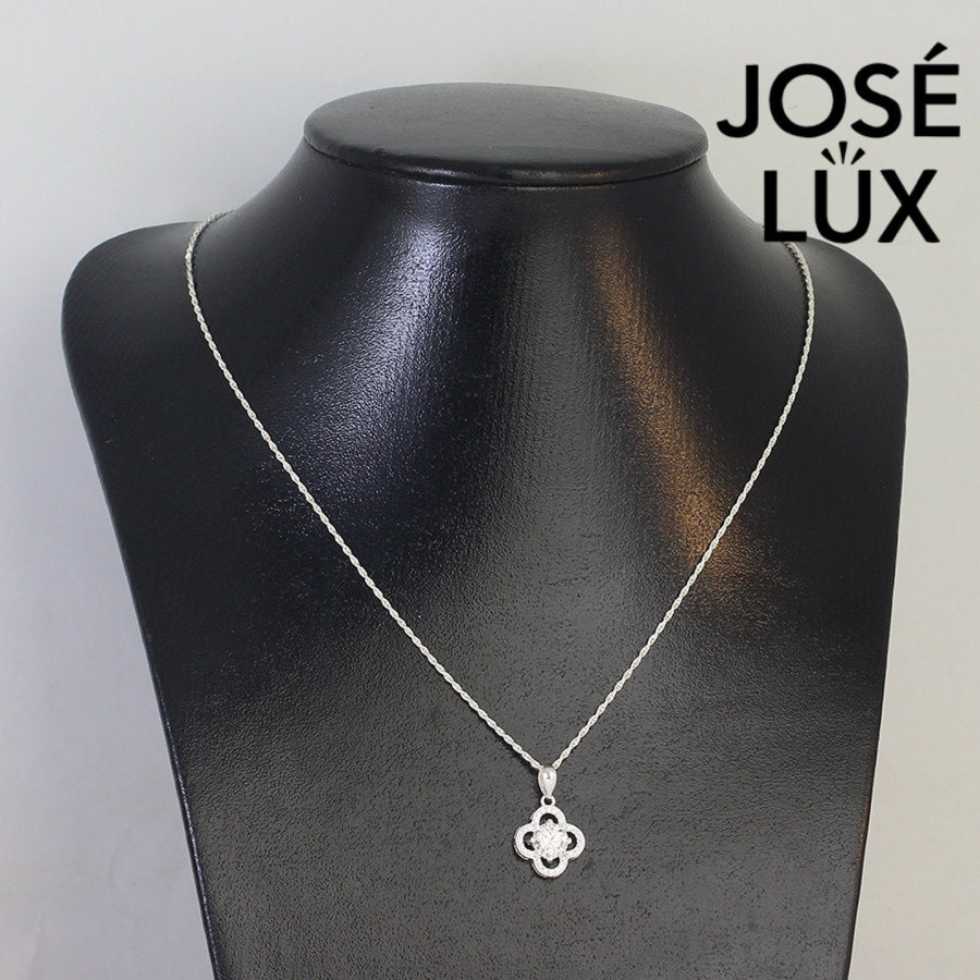 Lucky 1ct round moissanite clover halo pendant symbolizes good fortune with pavé-accented quatrefoil design, gracefully handcrafted in polished sterling silver.