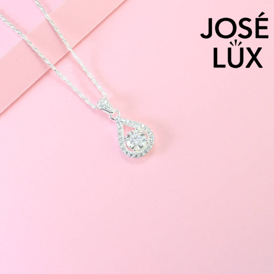 Contemporary 1ct round moissanite open teardrop halo pendant showcases brilliant center stone within elegant wishbone frame, beautifully designed in sterling silver.