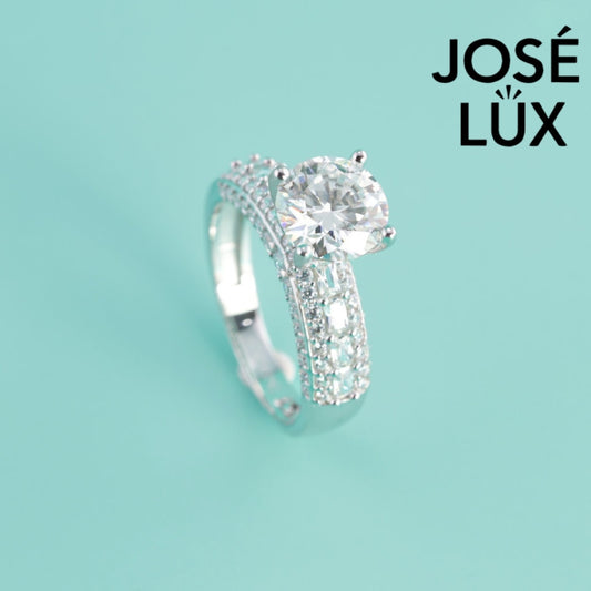 Timeless 2 carat moissanite stone set in classic silver band design. Perfect balance of traditional elegance and modern brilliance for discerning women.