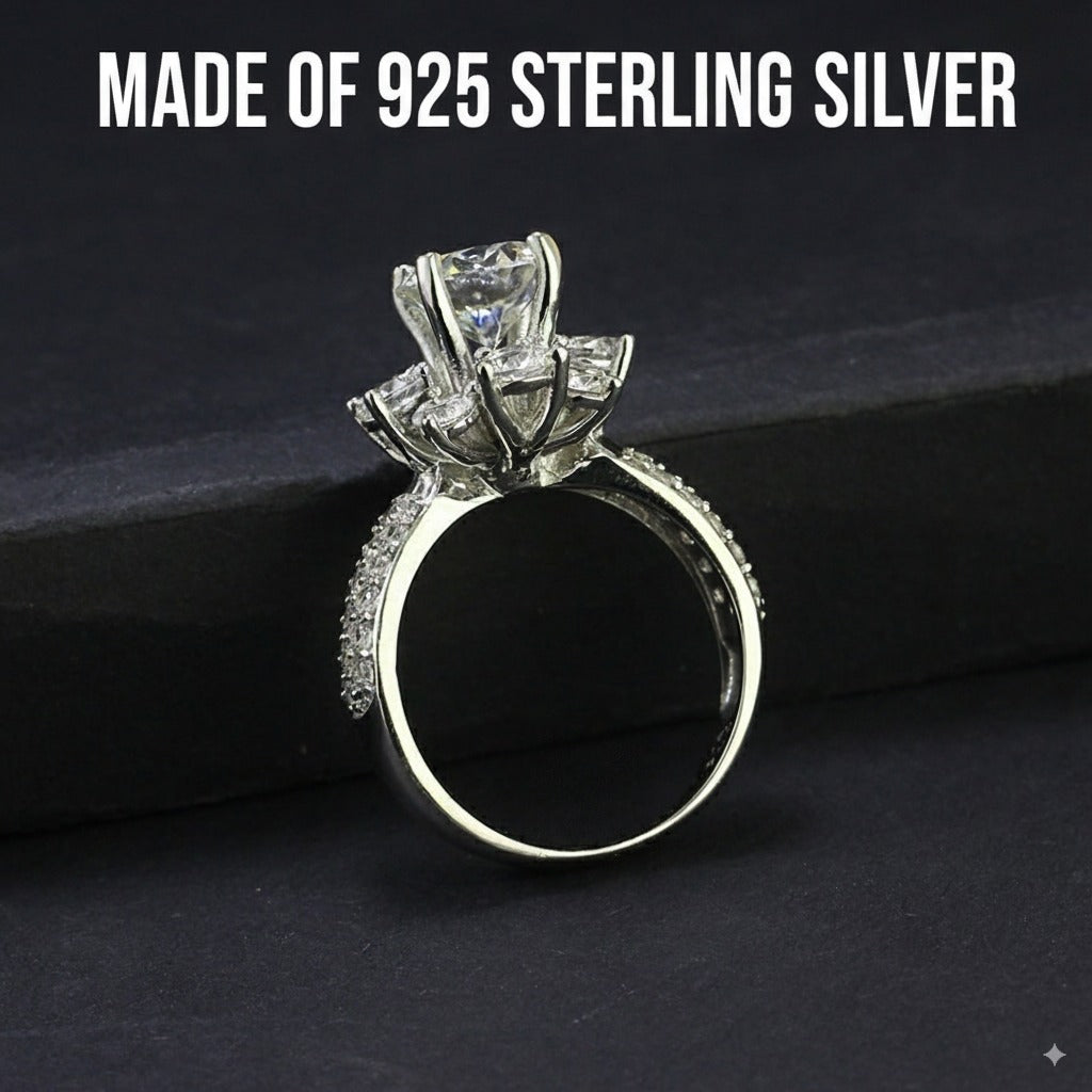 Stunning 2ct moissanite center stone surrounded by brilliant halo accents in a classic cluster design, beautifully crafted in sterling silver.