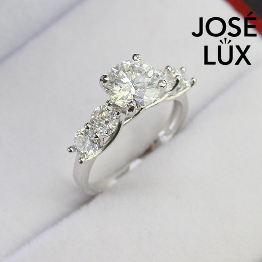 Stunning five moissanite stone design featuring a brilliant 2ct center stone with four accent moissanites, elegantly set in sterling silver