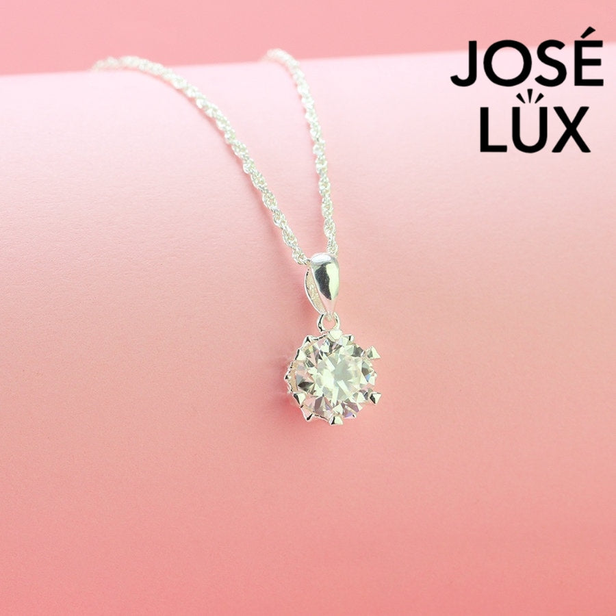 Classic 2ct round moissanite solitaire pendant showcases timeless elegance with six-prong setting, perfectly crafted in durable sterling silver for everyday sophistication.
