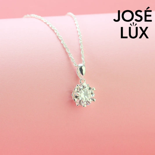 Classic 2ct round moissanite solitaire pendant showcases timeless elegance with six-prong setting, perfectly crafted in durable sterling silver for everyday sophistication.