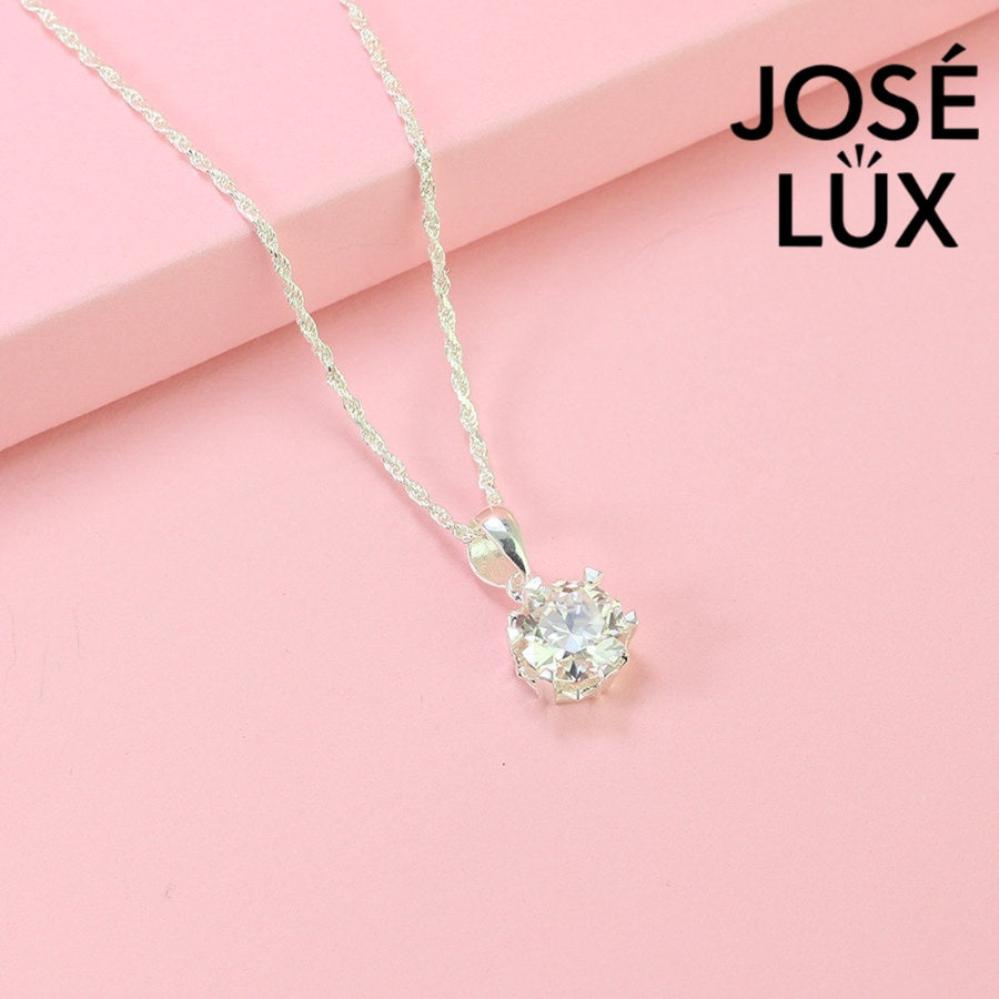 Classic 2ct round moissanite solitaire pendant showcases timeless elegance with six-prong setting, perfectly crafted in durable sterling silver for everyday sophistication.
