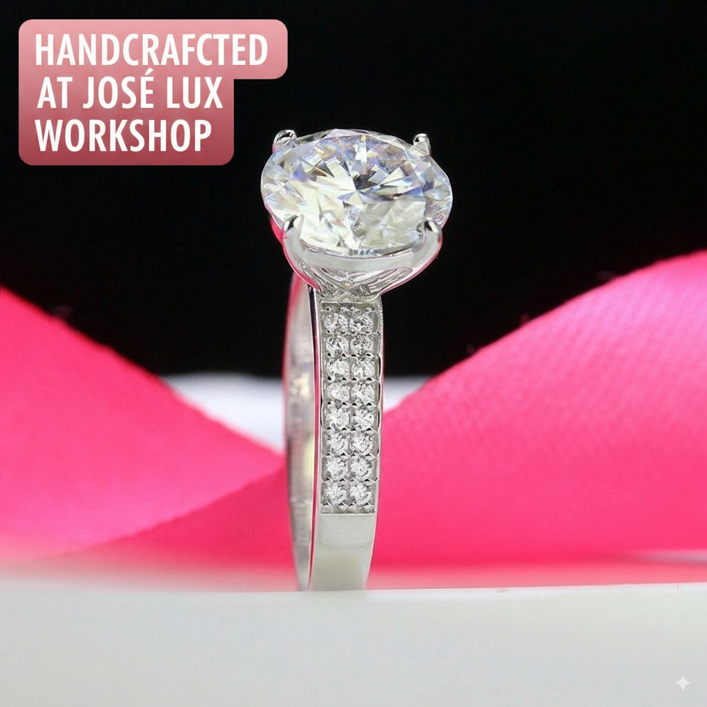 Elegant 4ct round moissanite solitaire ring featuring brilliant sparkle and pavé diamond accents on a polished sterling silver band for timeless sophistication.