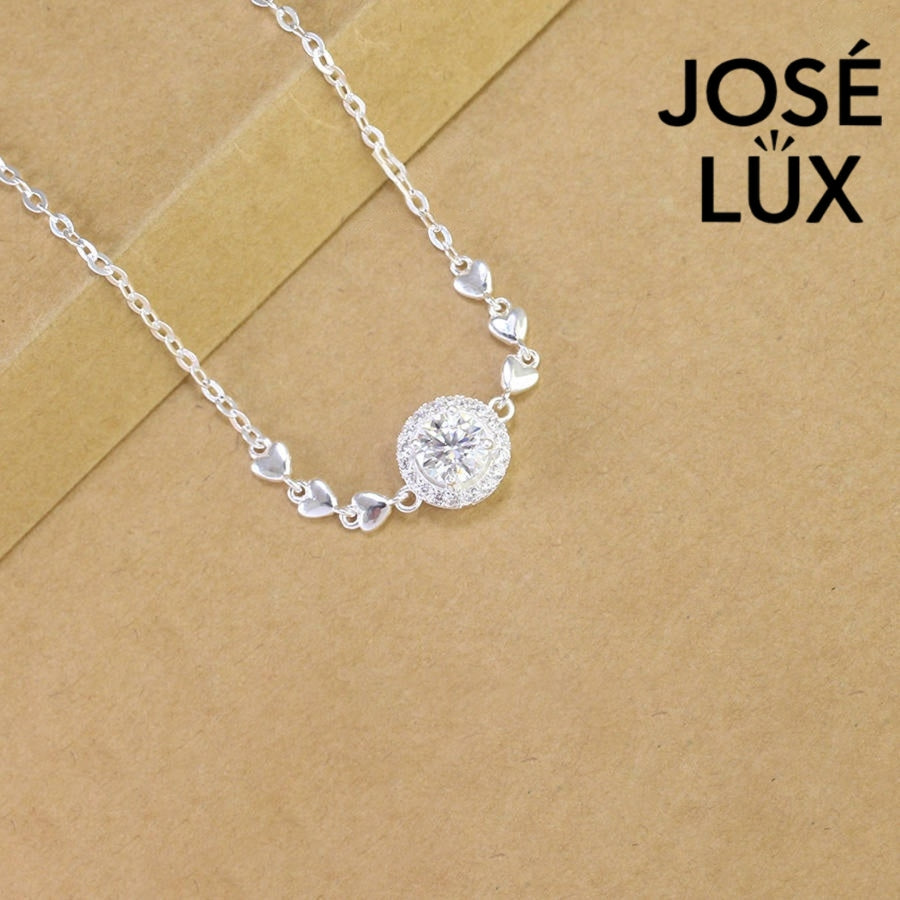 Cable chain halo moissanite bracelet in sterling silver features round brilliant centerpiece with heart accents weighing 1.0 carat on adjustable chain design.