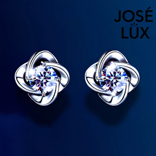 Brilliant moissanite stones set in elegant flower-shaped silver settings. These versatile stud earrings add sophisticated sparkle to any outfit, perfect for daily wear or special occasions.