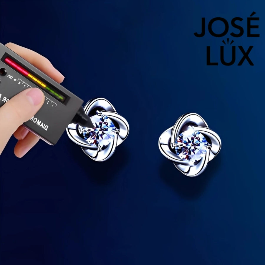 Brilliant moissanite stones set in elegant flower-shaped silver settings. These versatile stud earrings add sophisticated sparkle to any outfit, perfect for daily wear or special occasions.