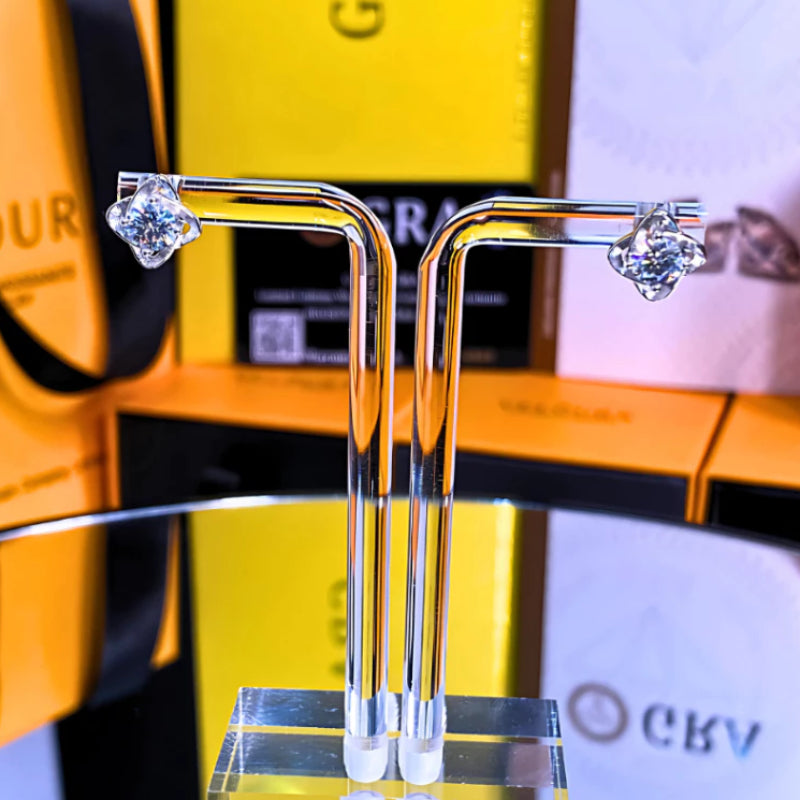 Brilliant moissanite stones set in elegant flower-shaped silver settings. These versatile stud earrings add sophisticated sparkle to any outfit, perfect for daily wear or special occasions.