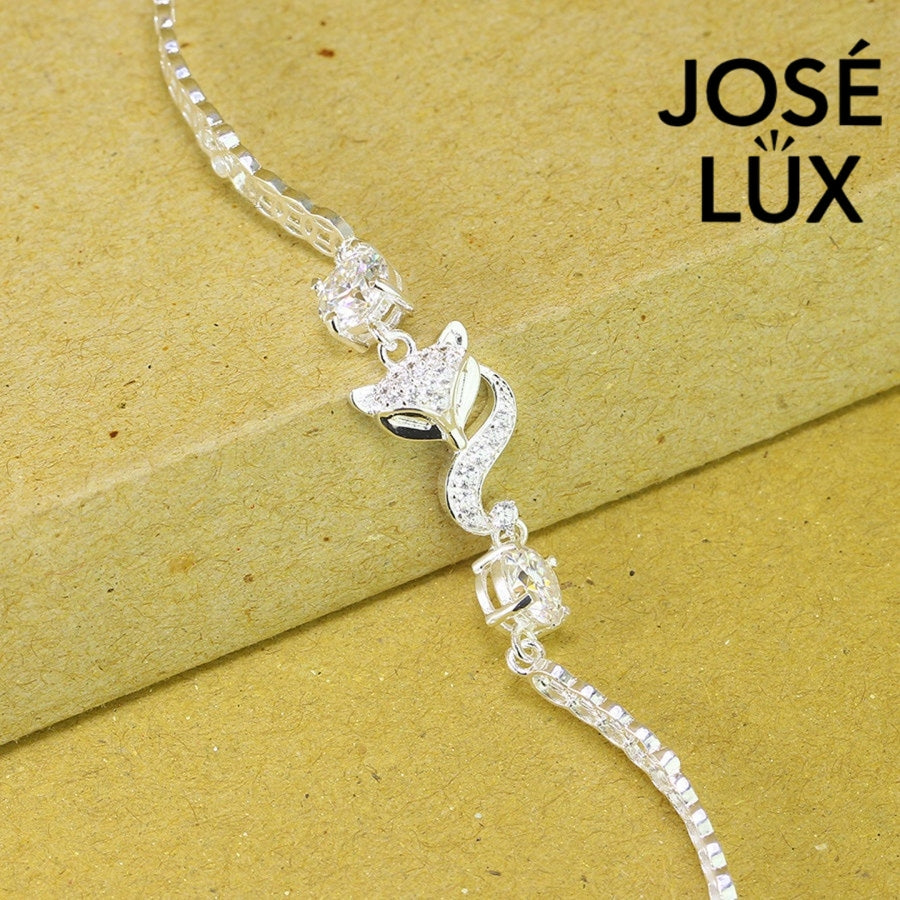 Fox charm tennis moissanite bracelet in sterling silver showcases charming animal centerpiece with two brilliant stones totaling 1.02 carats on classic chain.