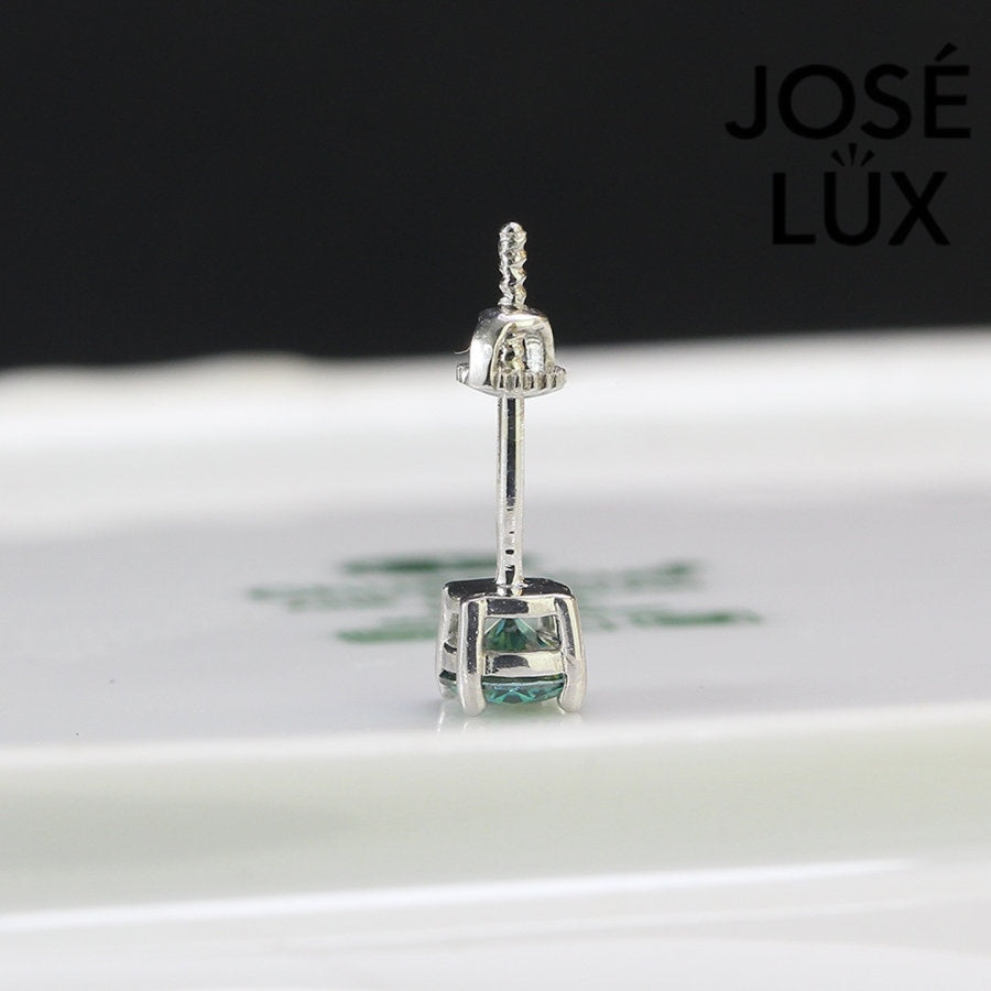 Sterling silver studs with 0.5ct vibrant green moissanite. Classic round cut in 4-prong setting delivers bold color and brilliant sparkle with secure screw-back posts for everyday wear.