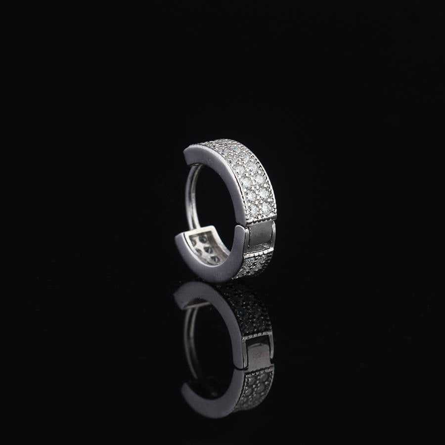 Iced Moissanite Hoop Earrings for Men in sterling silver with pavé-set stones, showcasing a sleek huggie hoop design against a black background.