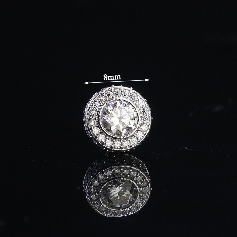 Iced Out Moissanite Halo Stud Earring for Men in sterling silver with 8mm round center stone and pavé halo setting, shown on black background.