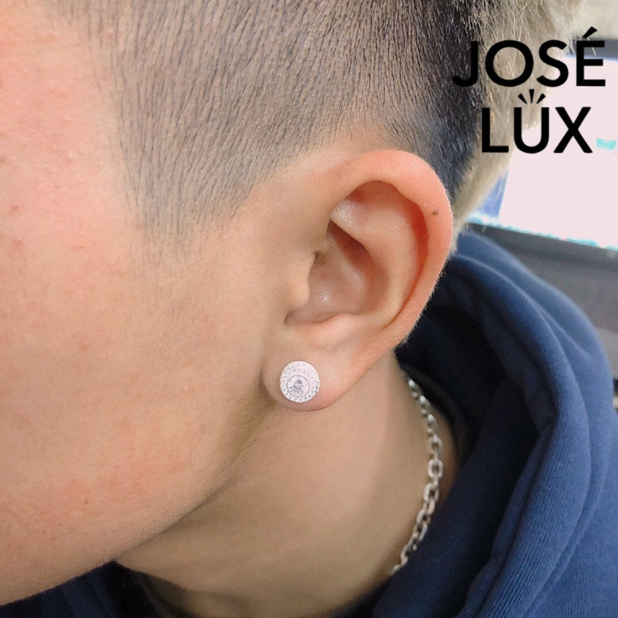 Sterling silver Moissanite Halo Stud Earring worn by man, showcasing round iced out design with pavé accents from José LUX collection.