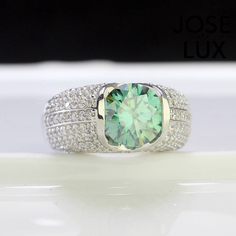 Front view of Men's Sterling Silver Green Moissanite Ring 4CT with Dome Pavé Band showcasing five rows of micro-pavé stones and a vivid green center stone.