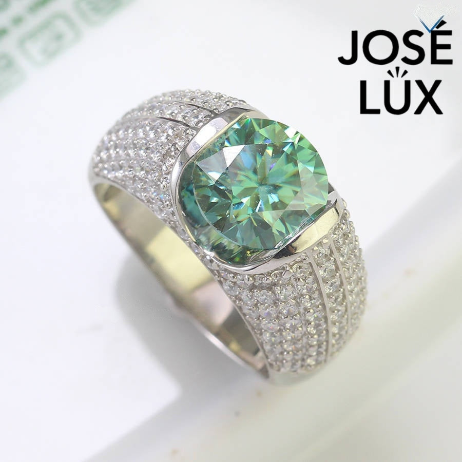 Angled top view of Men's Sterling Silver Green Moissanite Ring 4CT with Dome Pavé Band showing the brilliance of the green moissanite and pavé detailing.
