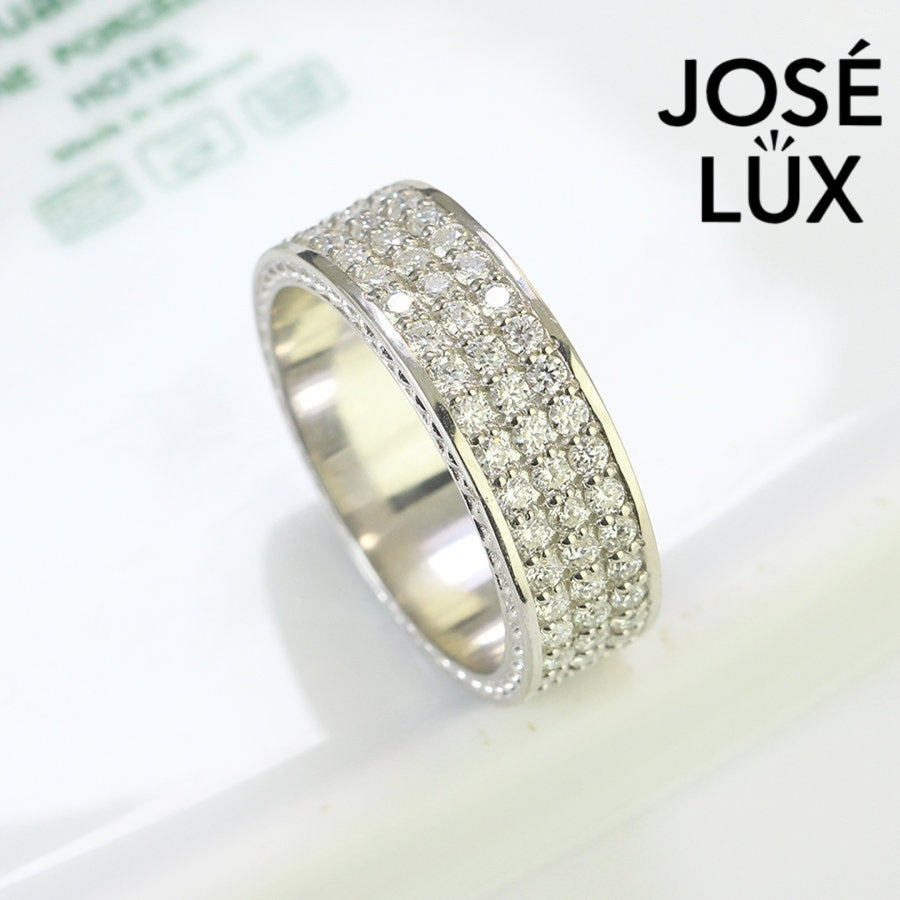 Sterling silver men's band ring features three rows of brilliant-cut moissanite stones in micro-pavé setting. Sleek profile with full coverage delivers continuous sparkle and comfortable fit for daily wear.