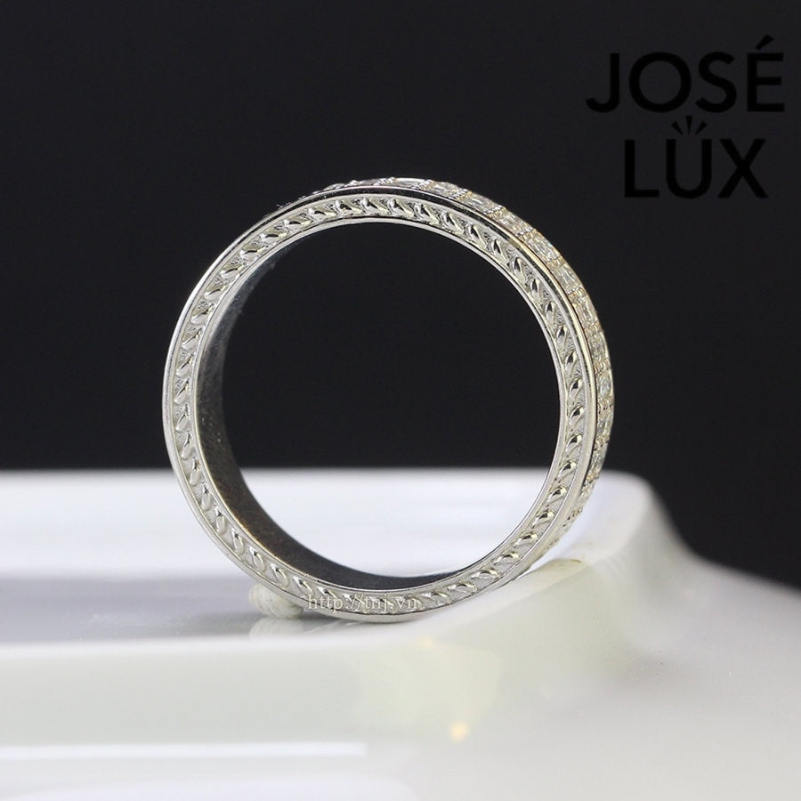 Sterling silver men's band ring features three rows of brilliant-cut moissanite stones in micro-pavé setting. Sleek profile with full coverage delivers continuous sparkle and comfortable fit for daily wear.