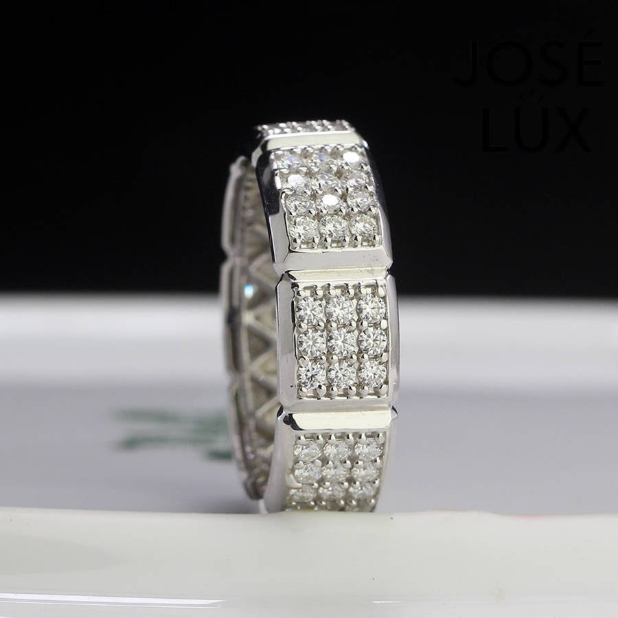 Close-up of Men's Sterling Silver Moissanite Eternity Band Ring showcasing segmented pavé design with high-shine moissanite stones in a modern setting.