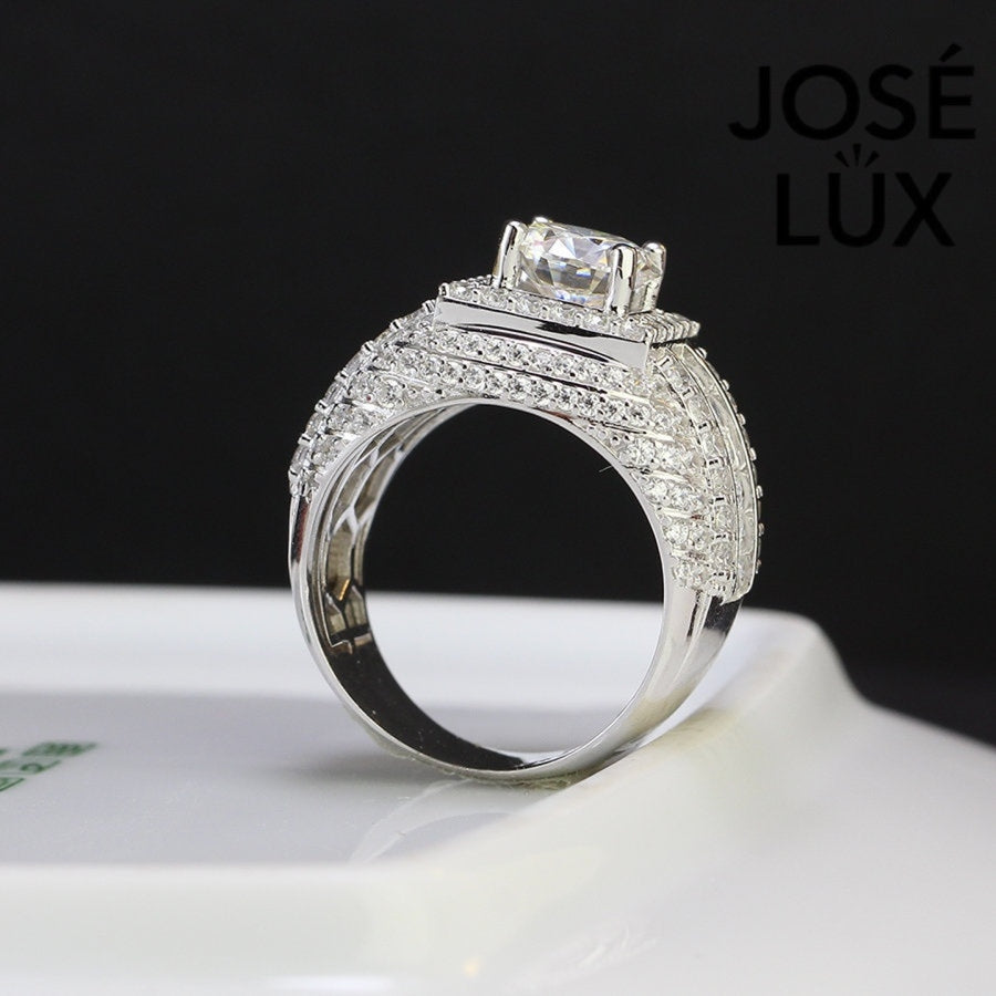 Profile angle of Men's Sterling Silver Moissanite Ring 2CT emphasizing the elevated setting and intricate halo with baguette accents.