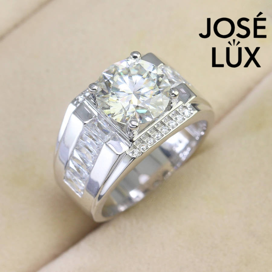 Men's Sterling Silver Moissanite Ring 4CT with Baguette Side Channels featuring a brilliant round-cut center stone and side diamonds on a velvet display.