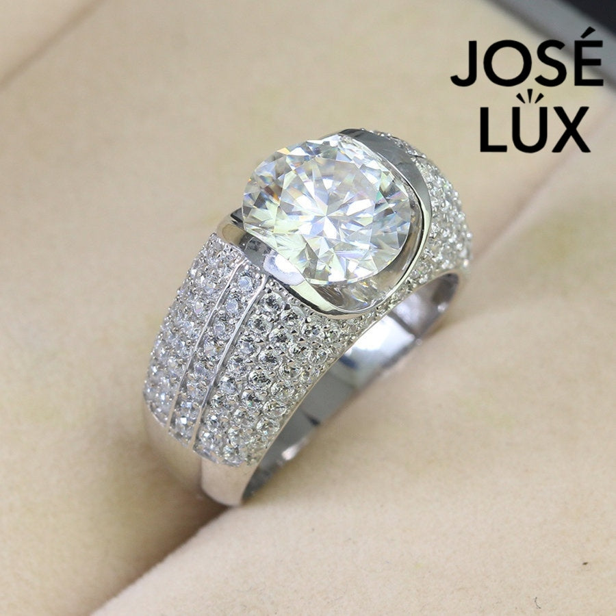 Men's Sterling Silver Moissanite Ring 4CT with Crescent Bezel Setting featuring a round-cut moissanite and micro-pavé stones on a wide band.