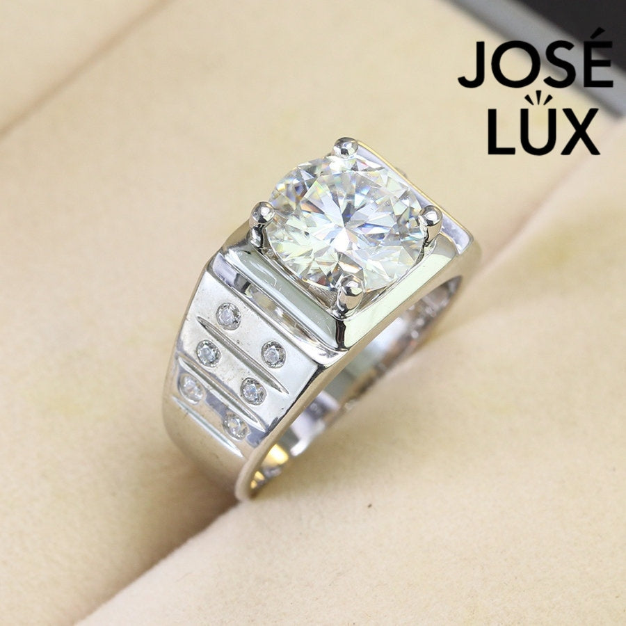 Men's Sterling Silver Moissanite Ring 4CT with Grooved Accent Band featuring a large round-cut moissanite center stone and side diamond accents.