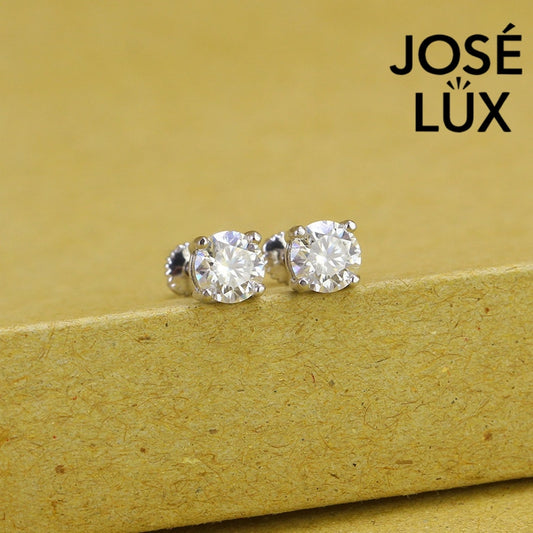 Timeless round moissanite with classic prong setting in sterling silver. Brilliant fire and exceptional clarity deliver understated elegance perfect for everyday wear.