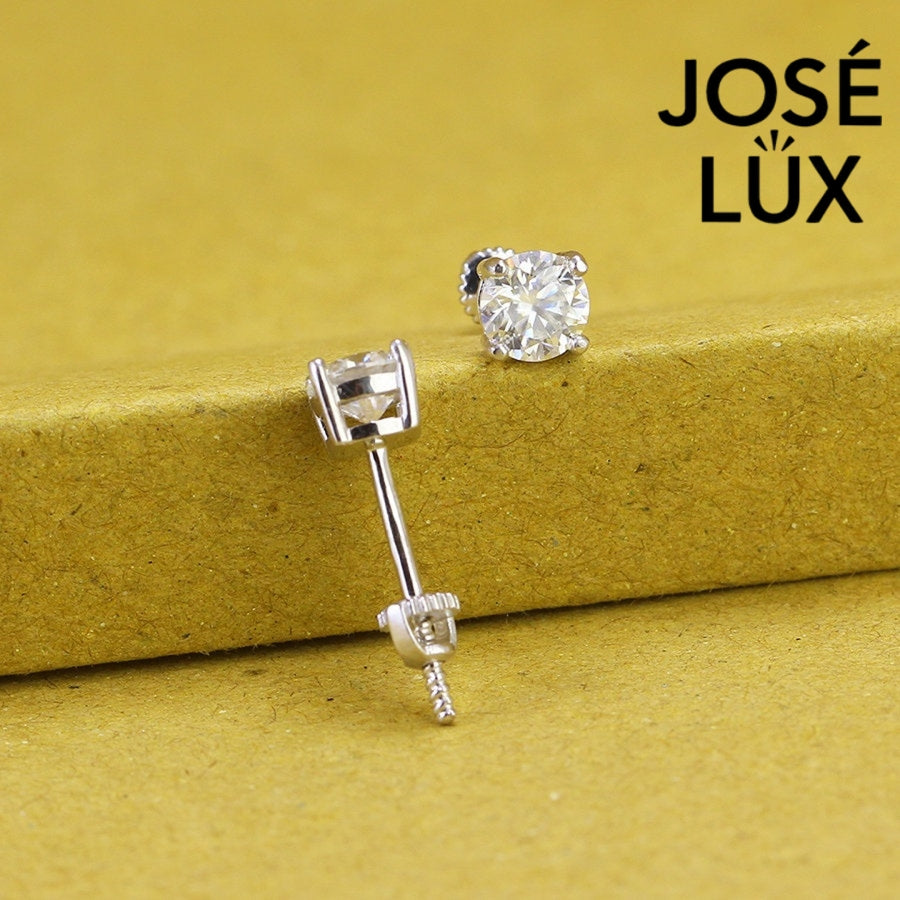 Timeless round moissanite with classic prong setting in sterling silver. Brilliant fire and exceptional clarity deliver understated elegance perfect for everyday wear.