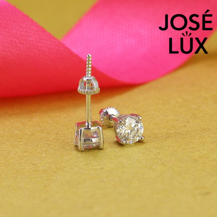 Timeless round moissanite with classic prong setting in sterling silver. Brilliant fire and exceptional clarity deliver understated elegance perfect for everyday wear.