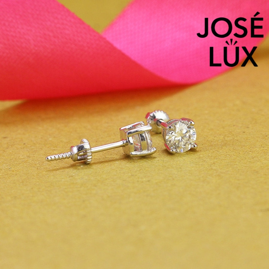 Timeless round moissanite with classic prong setting in sterling silver. Brilliant fire and exceptional clarity deliver understated elegance perfect for everyday wear.