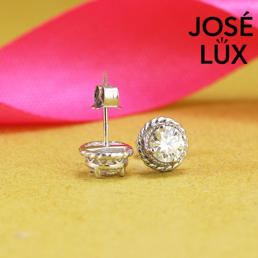 Elegant round moissanite with crown bezel setting in sterling silver. Regal design delivers brilliant fire and exceptional clarity for sophisticated everyday elegance.