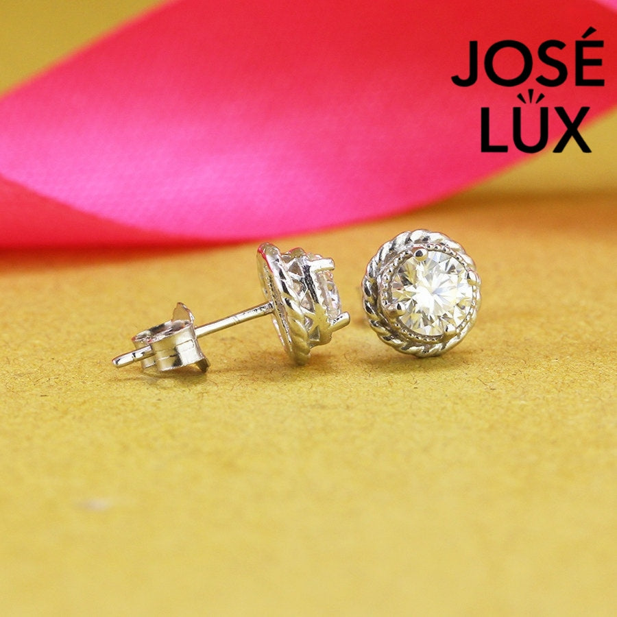 Elegant round moissanite with crown bezel setting in sterling silver. Regal design delivers brilliant fire and exceptional clarity for sophisticated everyday elegance.